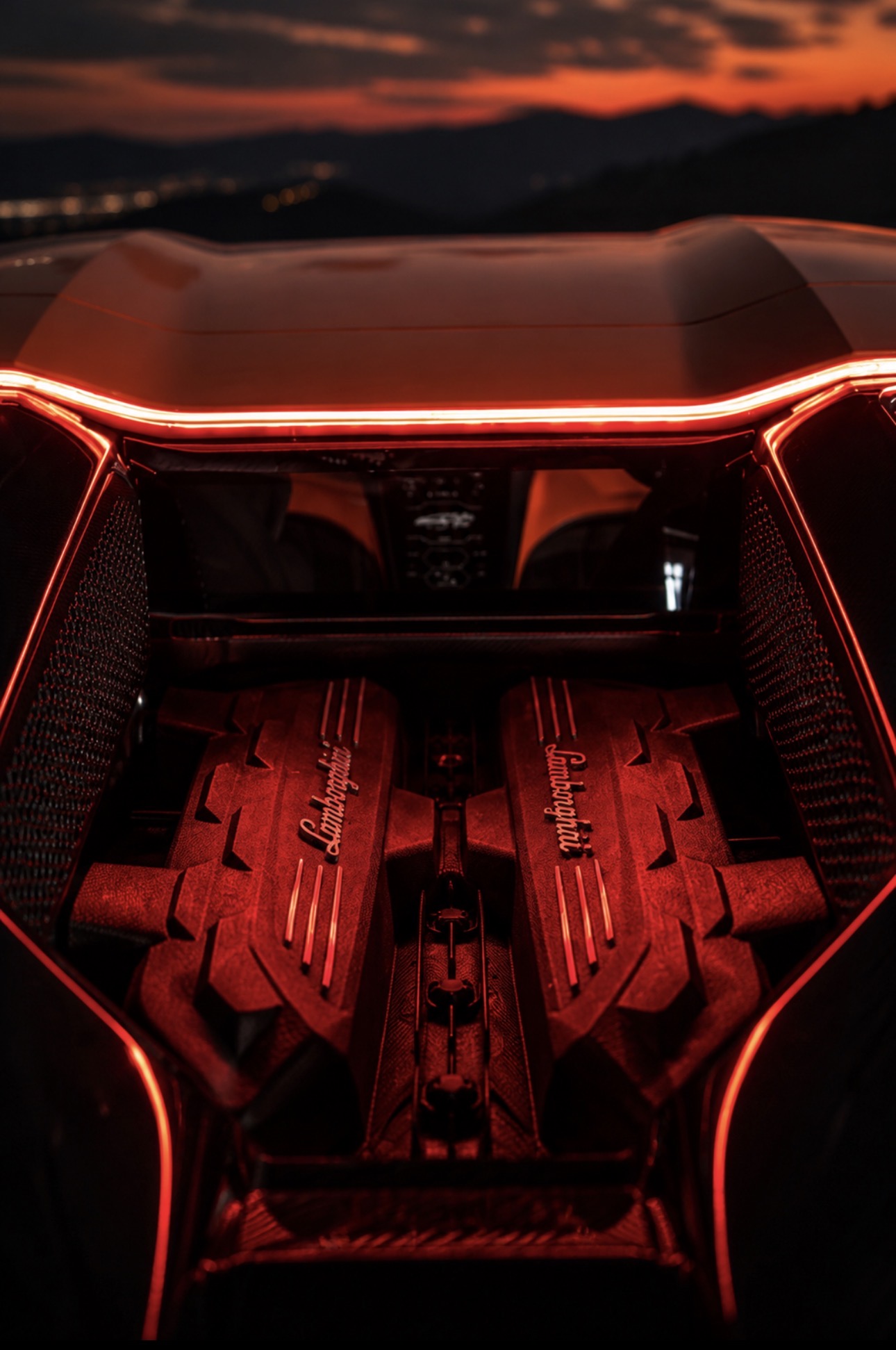 Red supercar engine detail at night