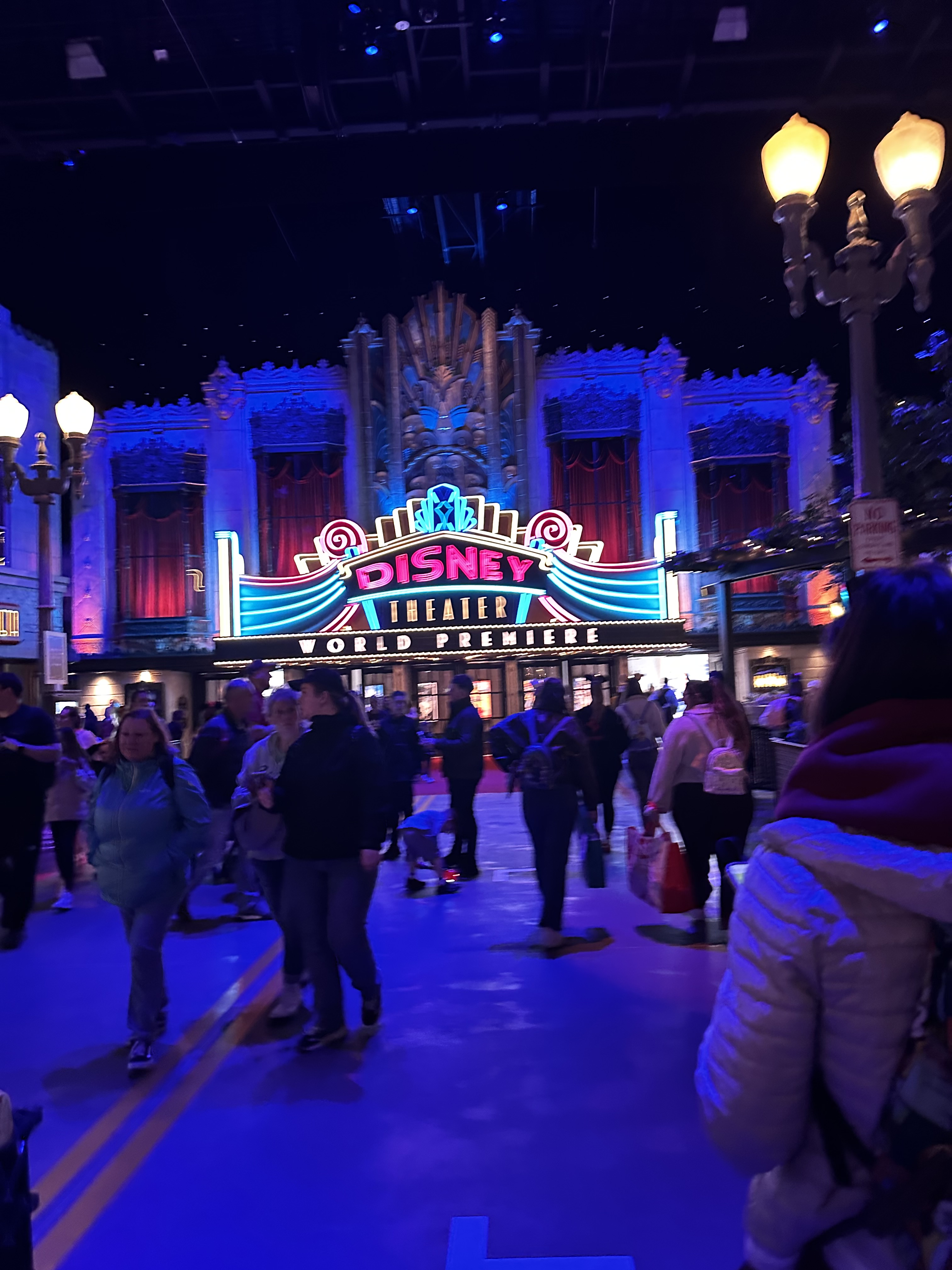 Neon theater sign in a cinematic blue scene