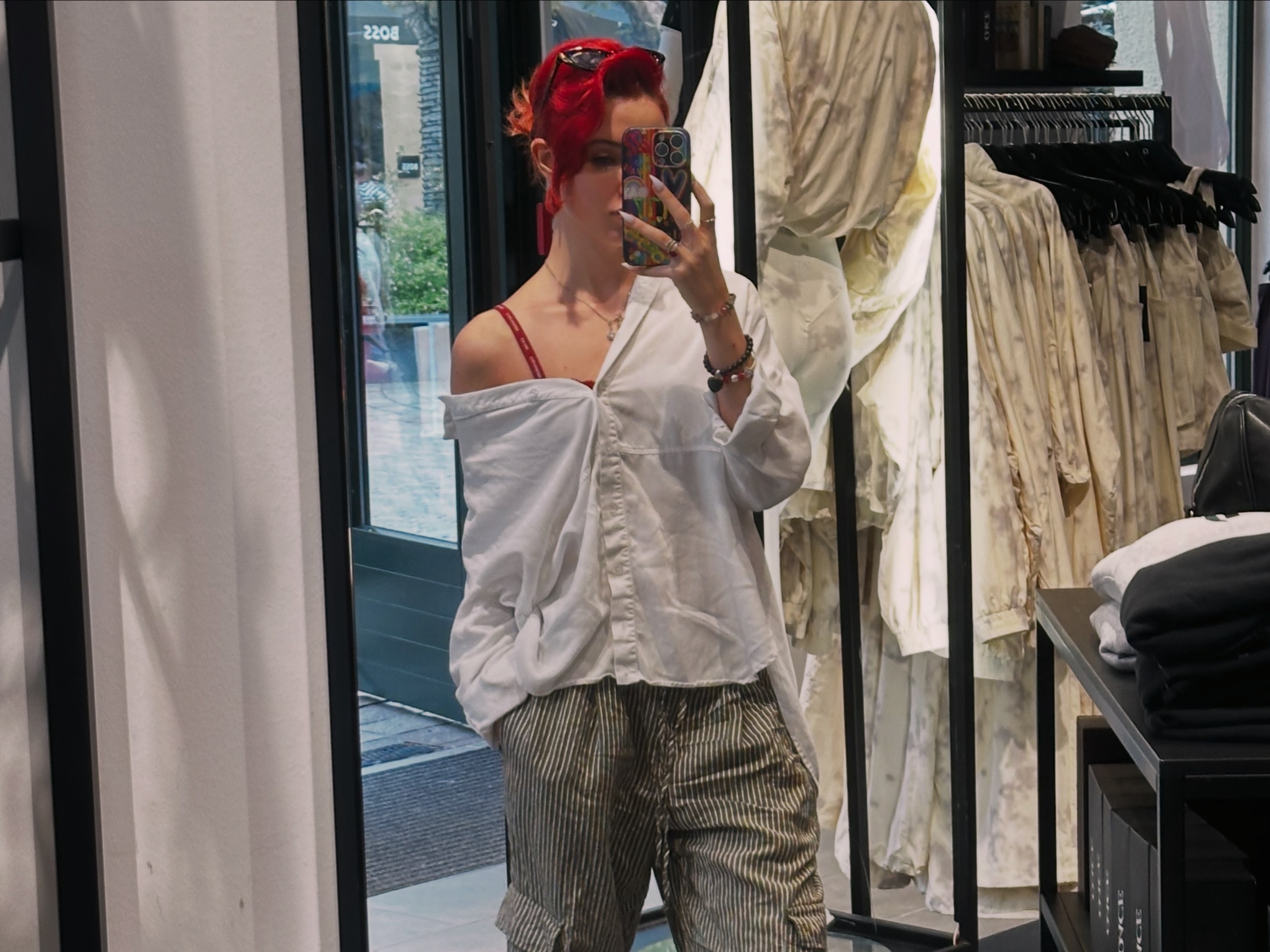 Alice Kwong taking a mirror photo while styling an outfit