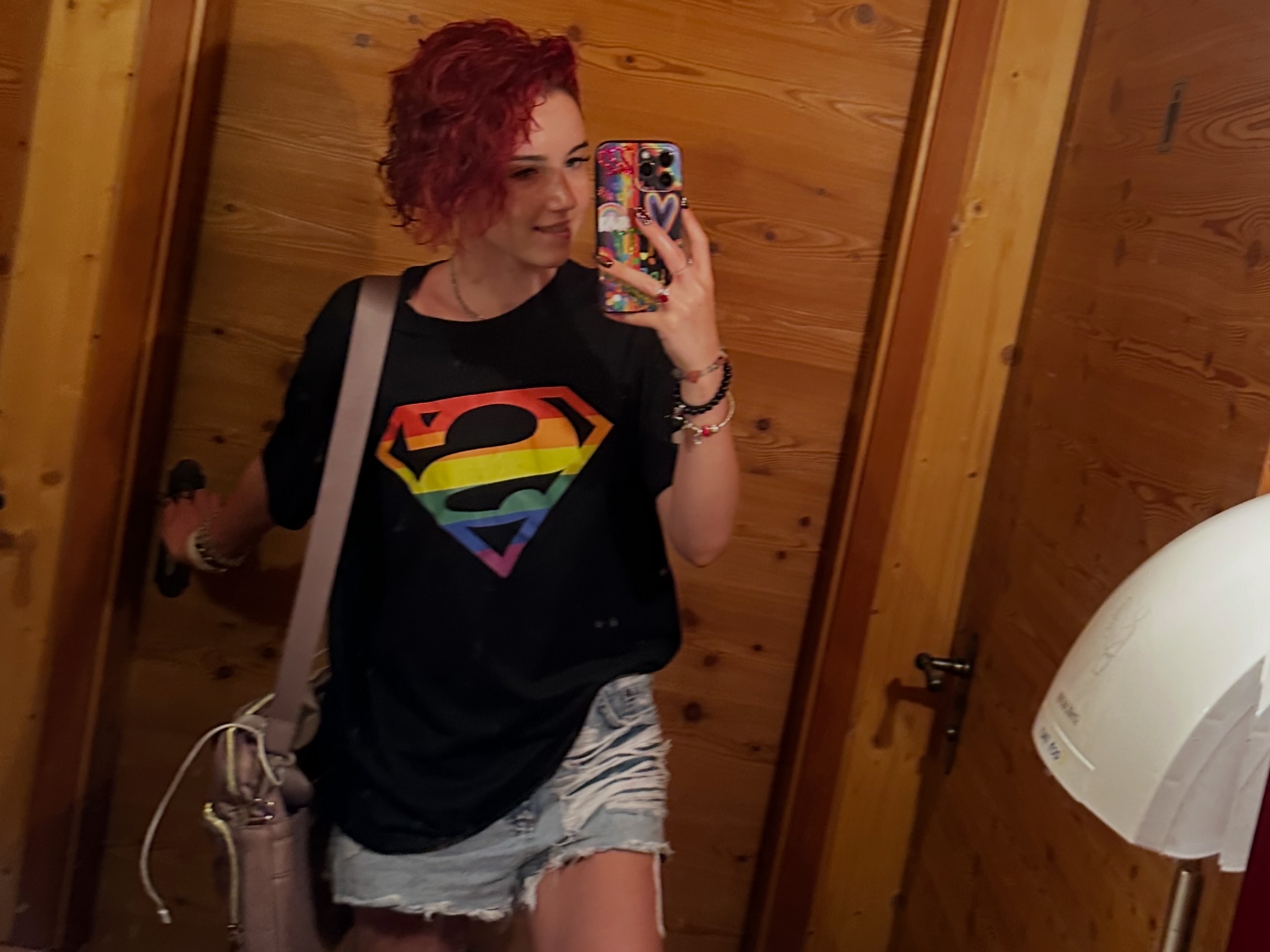 Alice Kwong in a casual Superman T-shirt mirror portrait